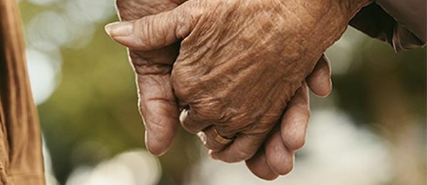 holding hands to give moral support while the patient is on dialysis